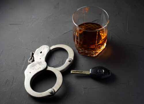 handcuffs alcohol car keys drunk driving DWI DUI